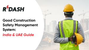RDASH promotional campaign image featuring the Rdash brand logo, headline Good Construction Safety Management System: India & UAE Guide, and a photograph of a construction professional wearing a hard hat and high-visibility safety vest looking out over an active building and crane site.
